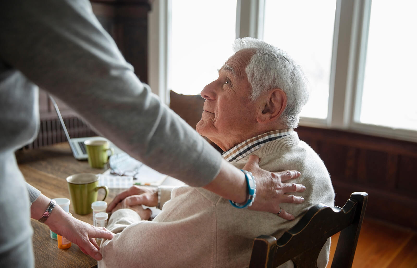 caregiver comforting senior